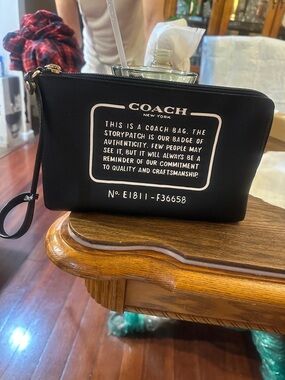 COACH Black Logo Zip Wristlet Toiletry Pouch